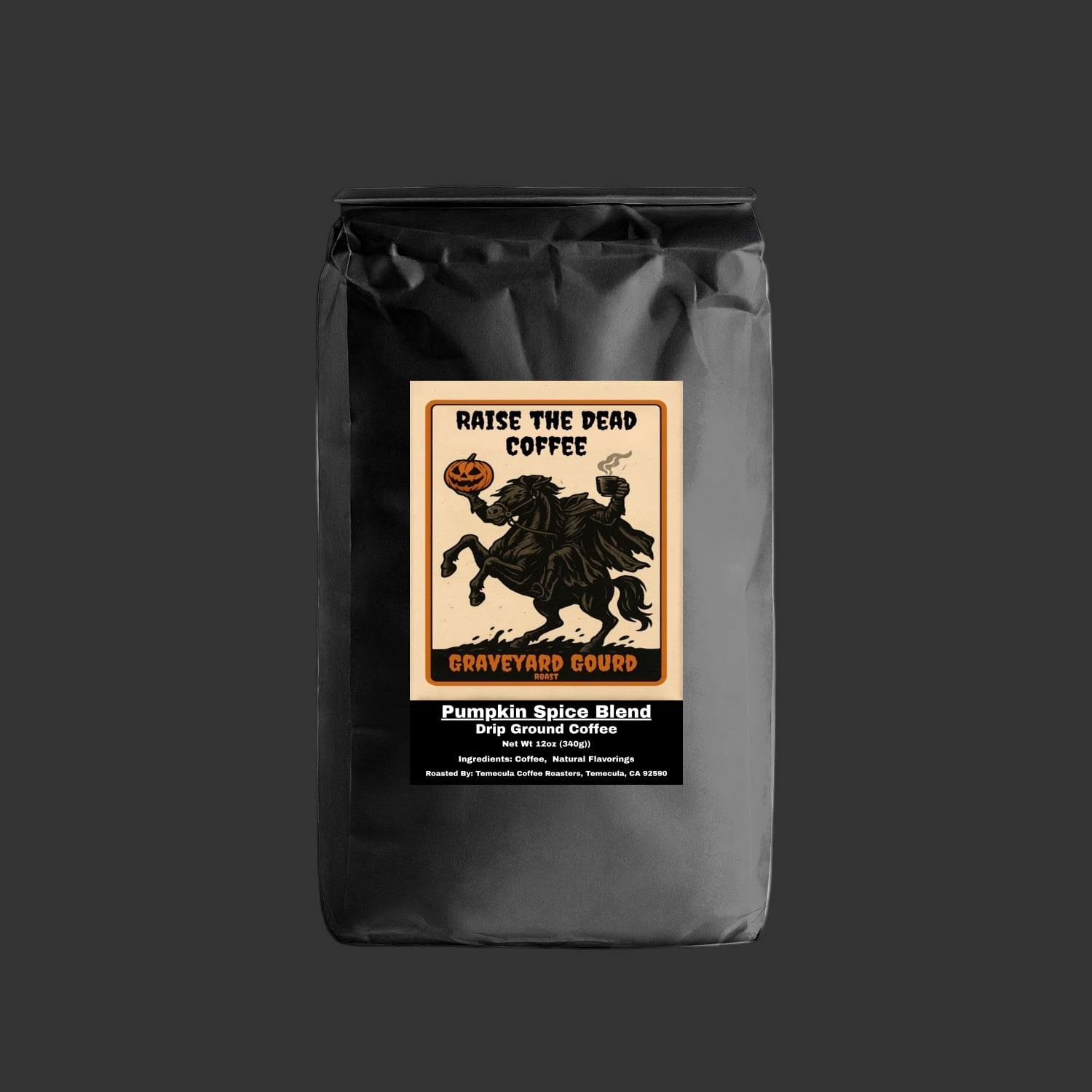Black coffee bag with 'Raise the Dead Coffee' label featuring a Halloween design on a white background